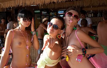 girl stroking cock on beach